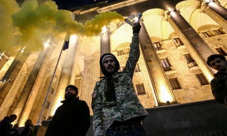 Protesters with flares demonstrate against the ‘foreign agents’ law in Tbilisi last week.