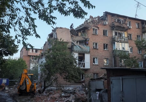 Rescuers work at a site of a residential building hit by a Russian missile strike, amid Russia’s attack on Ukraine, in Kharkiv, May 31.