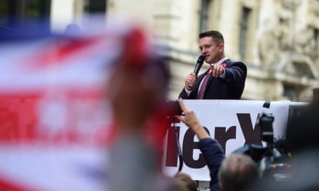 Former English Defence League leader Tommy Robinson addresses his supporters as he arrives at the Old Bailey where he is accused of contempt of court, 23 Oct 2018