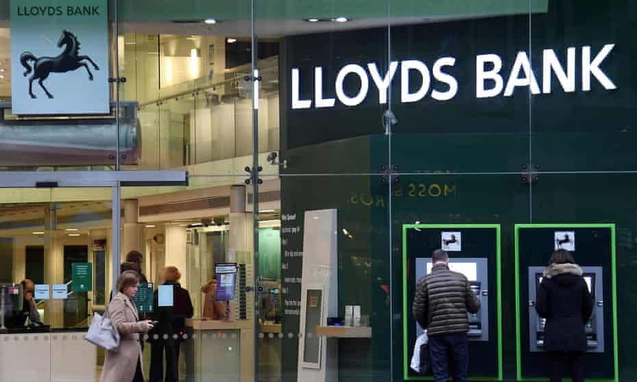 Customers at a branch of Lloyds bank in London.
