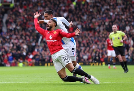 Maxence Lacroix of Crystal Palace fouls Matheus Cunha of Manchester United to give away a penalty.