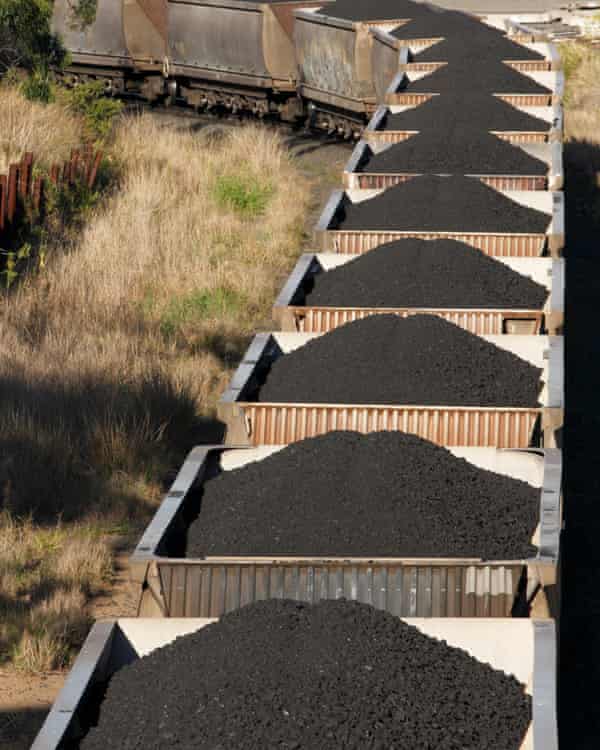 A trainload of black coal heads to port