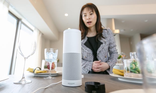 A woman interacts with Amazon Echo Plus.