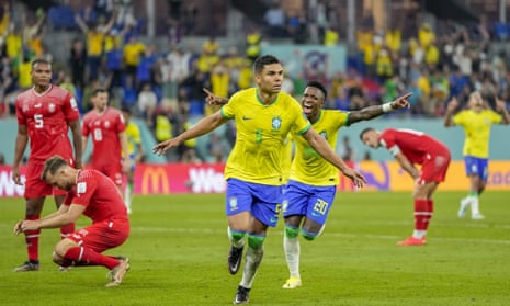 Brazil’s Casemiro celebrates scoring their first goal with Vinicius Junior.