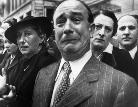 Frenchman Weeping at a flag parade in Marseille, 1941.