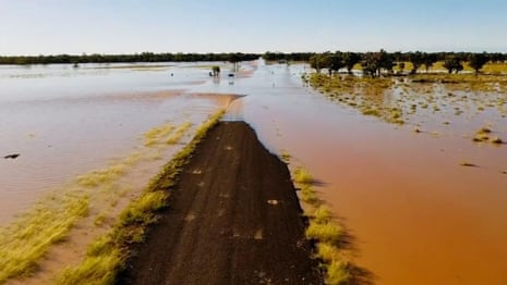 Drone footage captures flooded bridges and roads in rural parts of south-west Queensland  – video