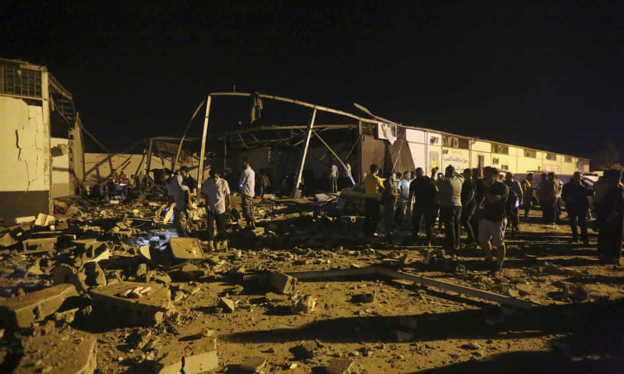 Libyan Red Crescent workers recover migrants bodies after an airstrike at a detention centre in Tajoura