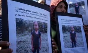 Central American migrants hold a demonstration after the death Jakelin Amei Rosmery Caal, seven, who died in a Texas hospital two days after being taken into custody by US border patrol agents.