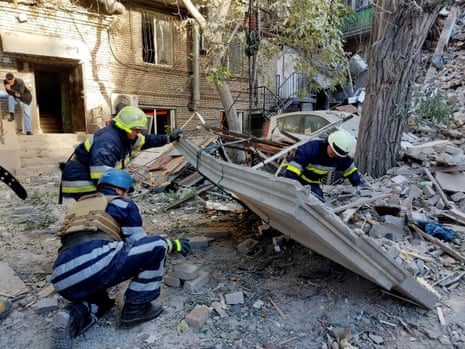 Rescue workers clear debris after a strike in Zaporizhzhia.