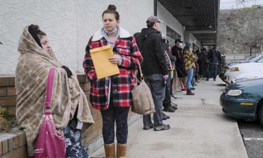 Evacuated residents of Merritt, BC, line up at a reception centre in Kelowna.