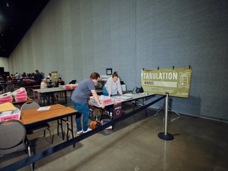 people lean over table