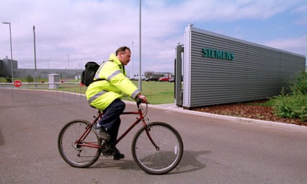 Man on bike outside Siemens plant