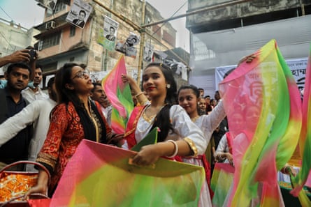 Female dancers wave coloured fabric