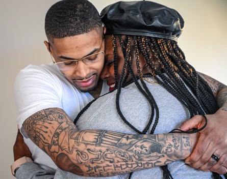 Keith Davis Jr hugs his wife Kelly after his release from custody on Friday, in Baltimore.