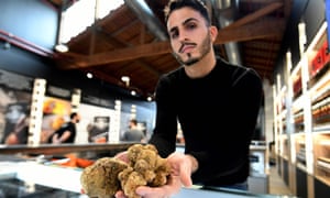 A vendor presents truffles.