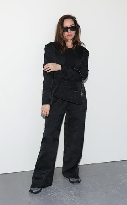 Aubrey Plaza wears a suit with Hoka sneakers to the Ulla Johnson fashion show during New York fashion week in February.