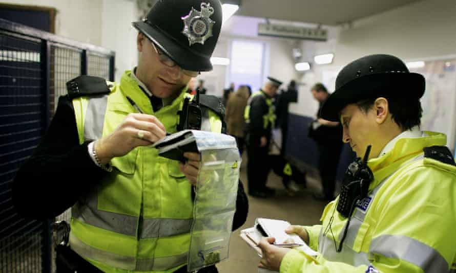 two British Transport police officers at a London Tube station