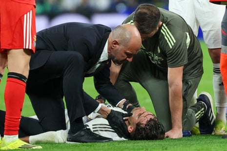 Raul Asencio receives medical attention after sustaining an injury