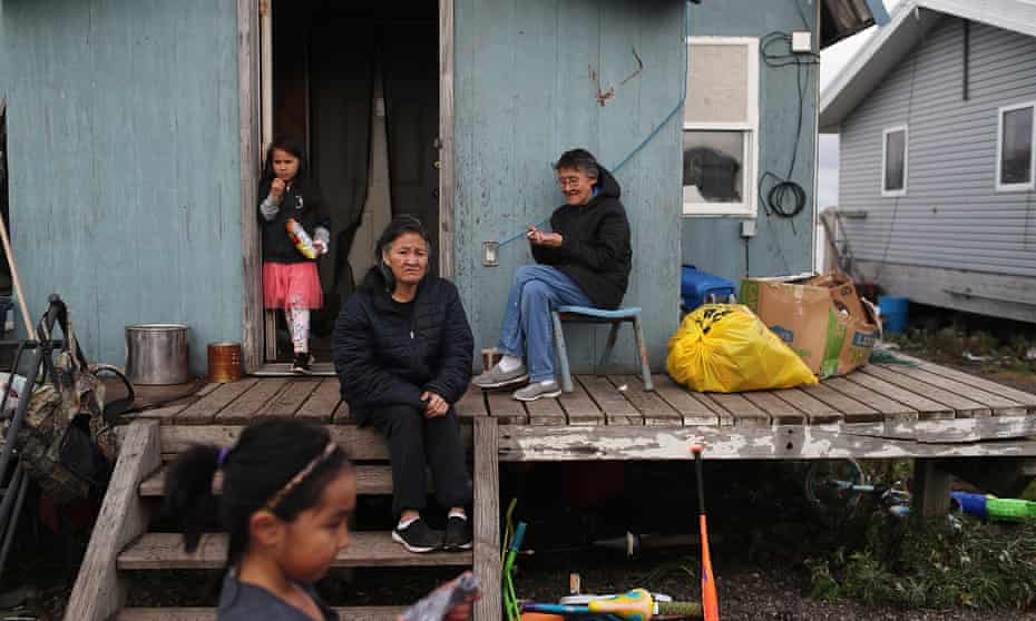 Lizzy Hawley, center, and her sister Ella Hawley, right, live in Kivalina, Alaska. An estimated one in three Native people live in what the Census Bureau considers “hard-to-count” areas.