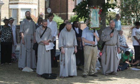 Catholic anti-abortionists praying and leaflettng at the Marie Stopes Clinic in Ealing, London.
