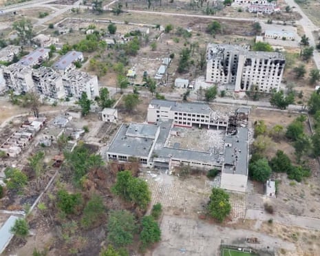 Aerial view of severely damaged, bombed-out buildings in Oleshky, Ukraine