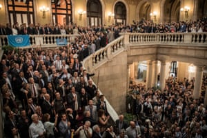 Mayors of Catalonia sing their anthem in the Catalan parliament building In Barcelona after the region’s President, Carles Puigdemont, seen on the balcony, had released the news that the Catalan Parliament had voted in favour of independence from Spain