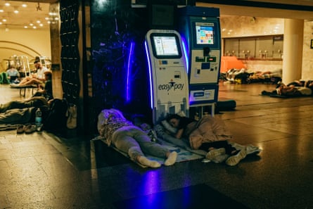 People sleeping inside Dorogozhychi subway station.