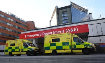 Bright yellow ambulances outside a hospital's emergency department