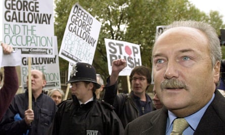 Galloway walks past supporters holding anti-war placards