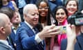 US president Joe Biden takes a selfie with students after his speech at Ulster University in Northern Ireland.