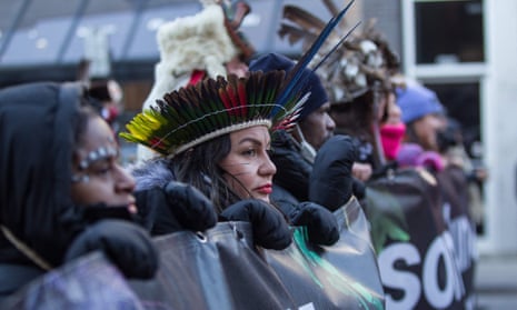 Members of the Indigenous community take part in a march for biodiversity for human rights at Cop15 in Montreal, Canada on 10 December