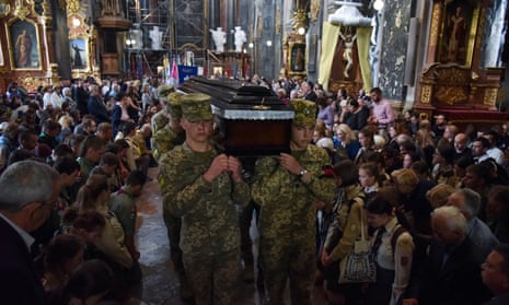 Ukrainian servicemen carry a coffin with the body of their comrade Artem Dymyd, who was recently killed in a battle against Russian troops, as Russia’s attack on Ukraine continues, during a funeral ceremony in Lviv, Ukraine June 21, 2022.