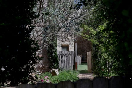Shrub-lined entrance to a building.