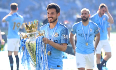 Manchester City’s David Silva celebrates on the pitch with the Premier League trophy in 2019.