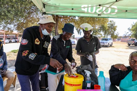 Three people provide a demonstration under a gazebo in Mamelido, Pretoria