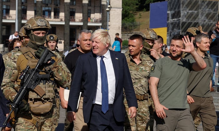 British PM Johnson and Ukrainian President Zelenskiy walk at the Independence Square in Kyiv.