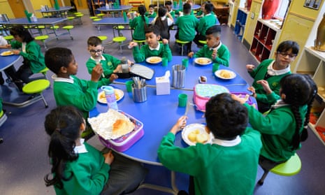 Children eat lunch at Greenacres primary academy in Oldham, Greater Manchester