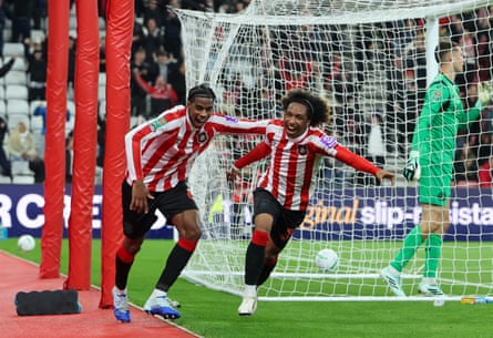 Malick Fofana of Sunderland (right) celebrates with Dayann Methalie after scoring his team’s third goal.