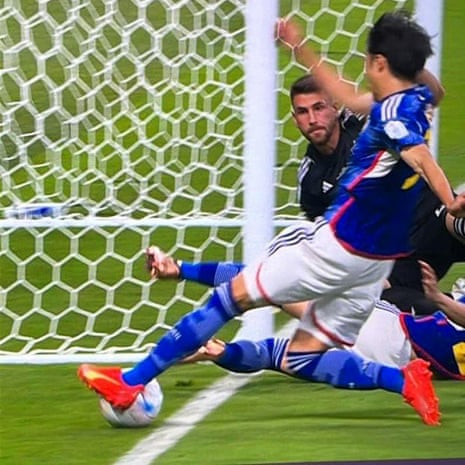 Japan’s Kaoru Mitoma appears to have the ball over the line before crossing it for a goal