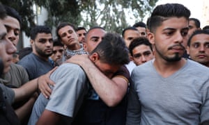 A teenager from Gaza City mourns his brother, killed during protests at the border fence with Israel, May 2018