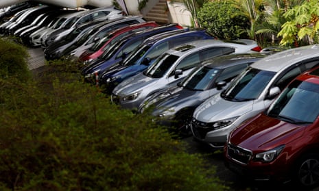 Cars at a dealership in Singapore. The quota, offered through a bidding process, has made it the most expensive city in the world to buy a car.