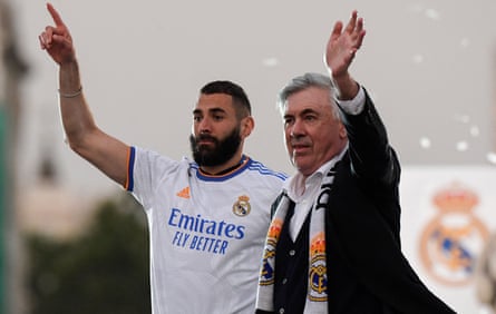 Carlo Ancelotti and Karim Benzema wave to fans in Madrid during the team’s title parade.