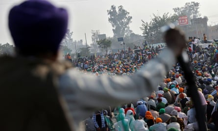 Farmers attend a protest against the newly passed farm bills at Singhu border near Delhi