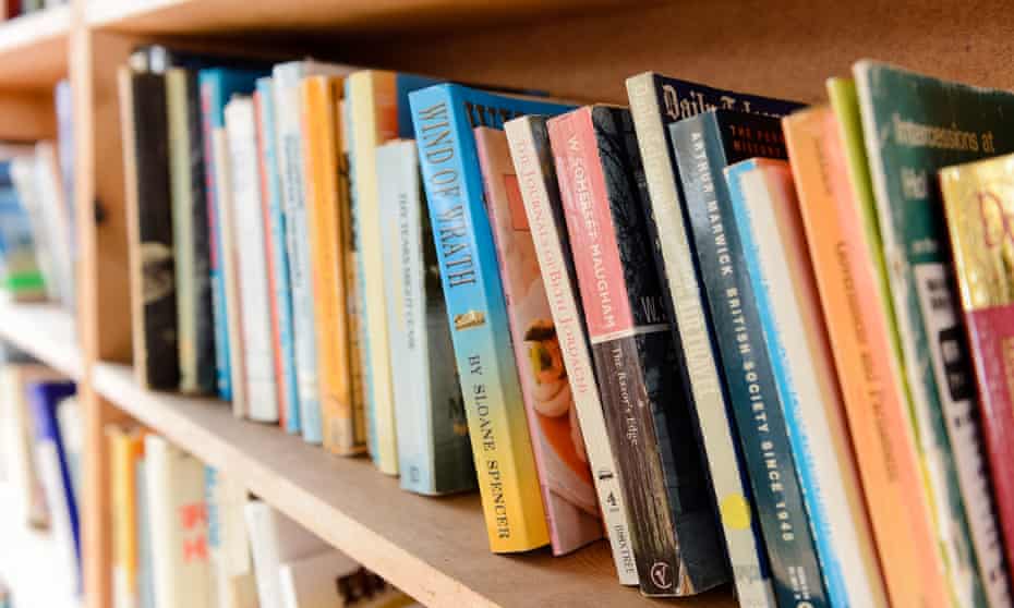 Close up image of a shelf full of books.