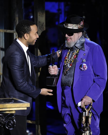Dr John receives his trophy from John Legend at the Rock and Roll Hall of Fame induction ceremony in New York, in 2011.