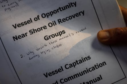 hand holds document that says âvessel of opportunity near shore oil recovery groupsâ. Below that handwriting says: âwhy wasnât these manuals reviewed during training classesâ