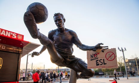 People gather in protest against the European Super League at the Emirates Stadium, London.