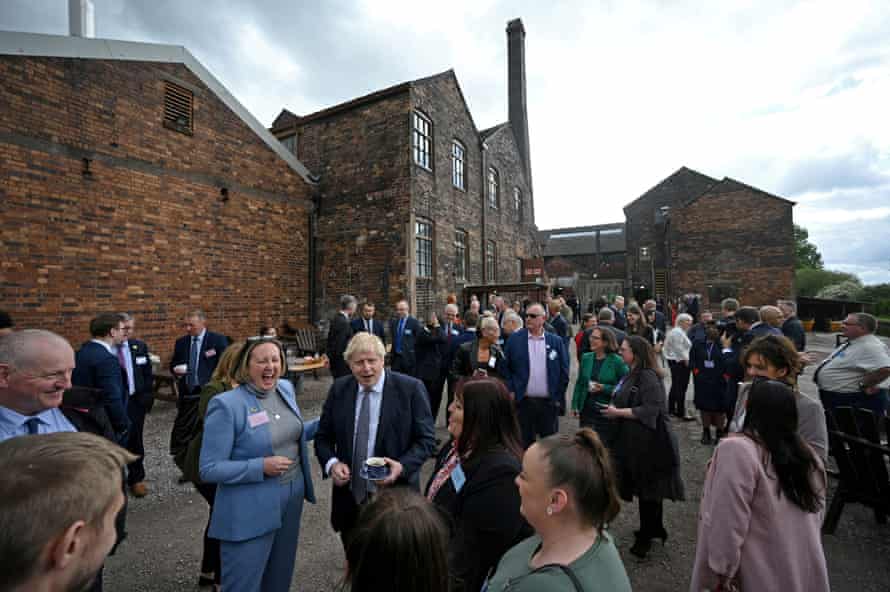 Boris Johnson and international trade secretary Anne-Marie Trevelyan talking with local business leaders after a cabinet meeting at a pottery in Stoke-on-Trent.