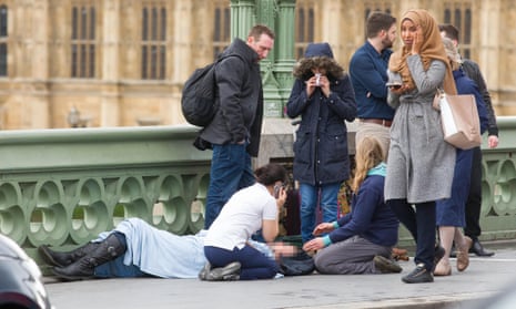 A woman in a headscarf passes the scene of the terrorist attack on Westminster Bridge in March. Russia-run accounts tried to stir anti-Islamic sentiment by falsely claiming she had ignored victims.