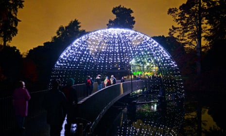 Visitors follow an illuminated trail in Kew Gardens.